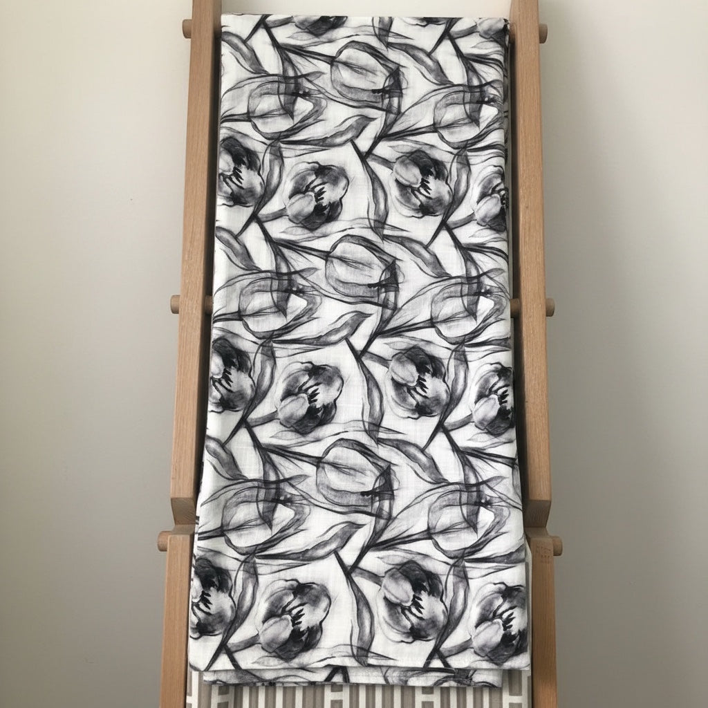 Eclectic charcoal and white polyslub tablecloth featuring a modern hand-painted tulip floral pattern.