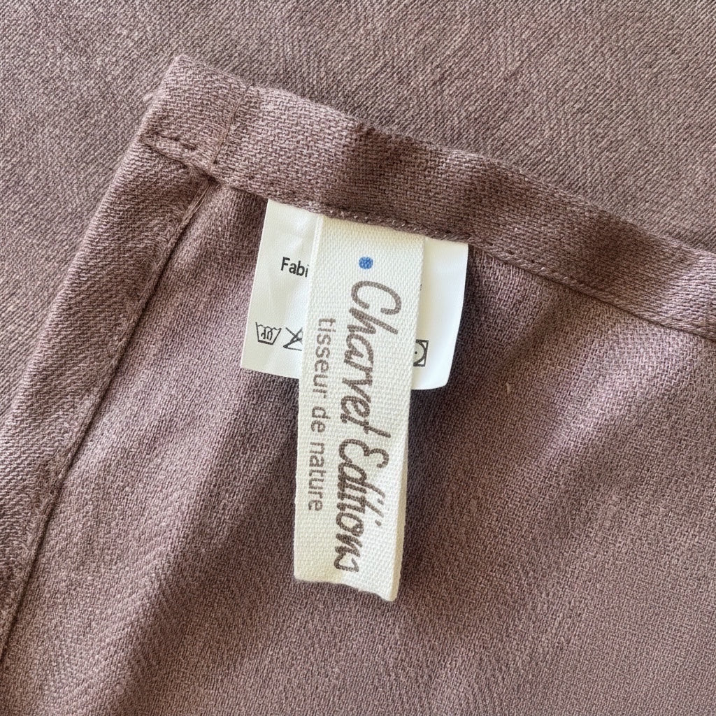 Eclectic Charvet Éditions chocolate brown 100% linen tablecloth featuring a detailed fabric weave and brand label.