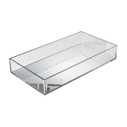 Eclectic clear acrylic rectangular display tray with a reflective mirrored base for home decor and luxury accessories.