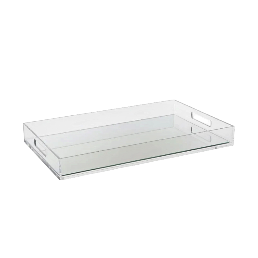Eclectic clear acrylic serving tray with a mirrored base and integrated handles for modern home decor styling.
