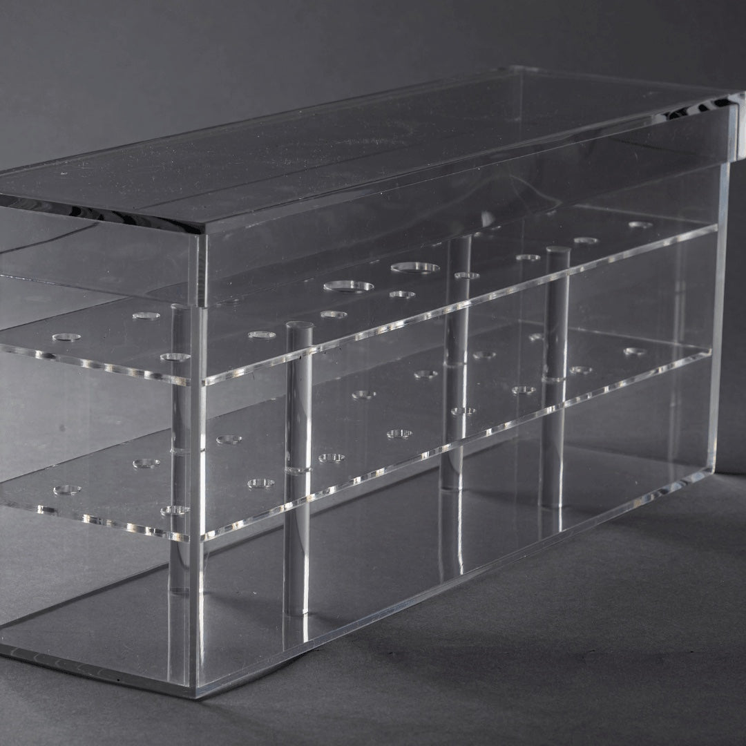 Eclectic clear acrylic Rose Box with multiple circular slots for floral arrangements on a grey background