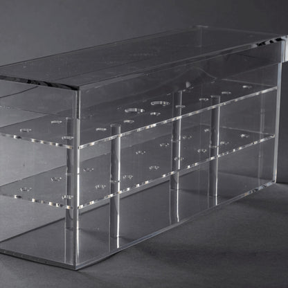 Eclectic clear acrylic Rose Box with multiple circular slots for floral arrangements on a grey background