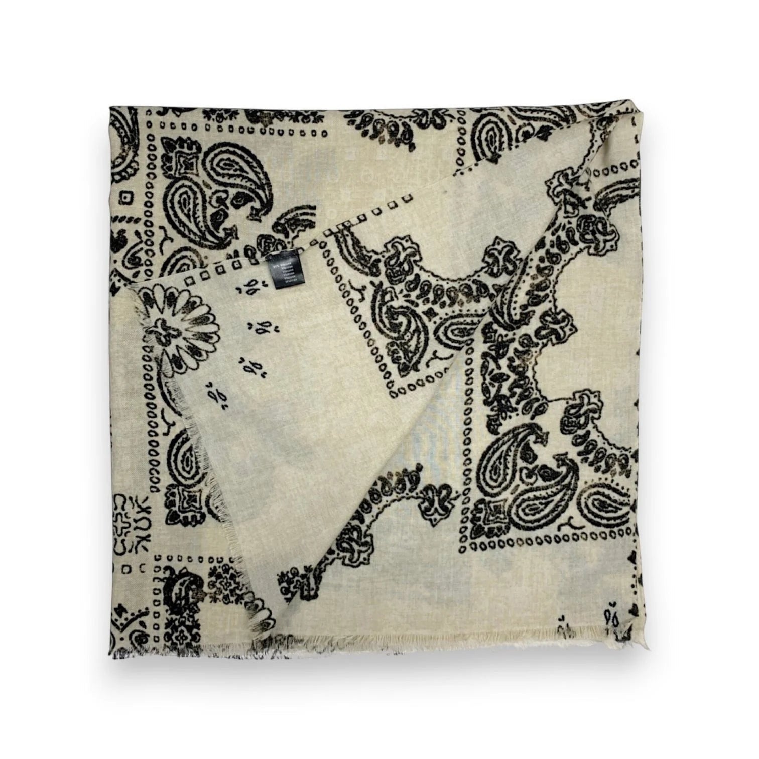 Eclectic cream wool blend scarf featuring a black oversized bandana paisley print with frayed edges