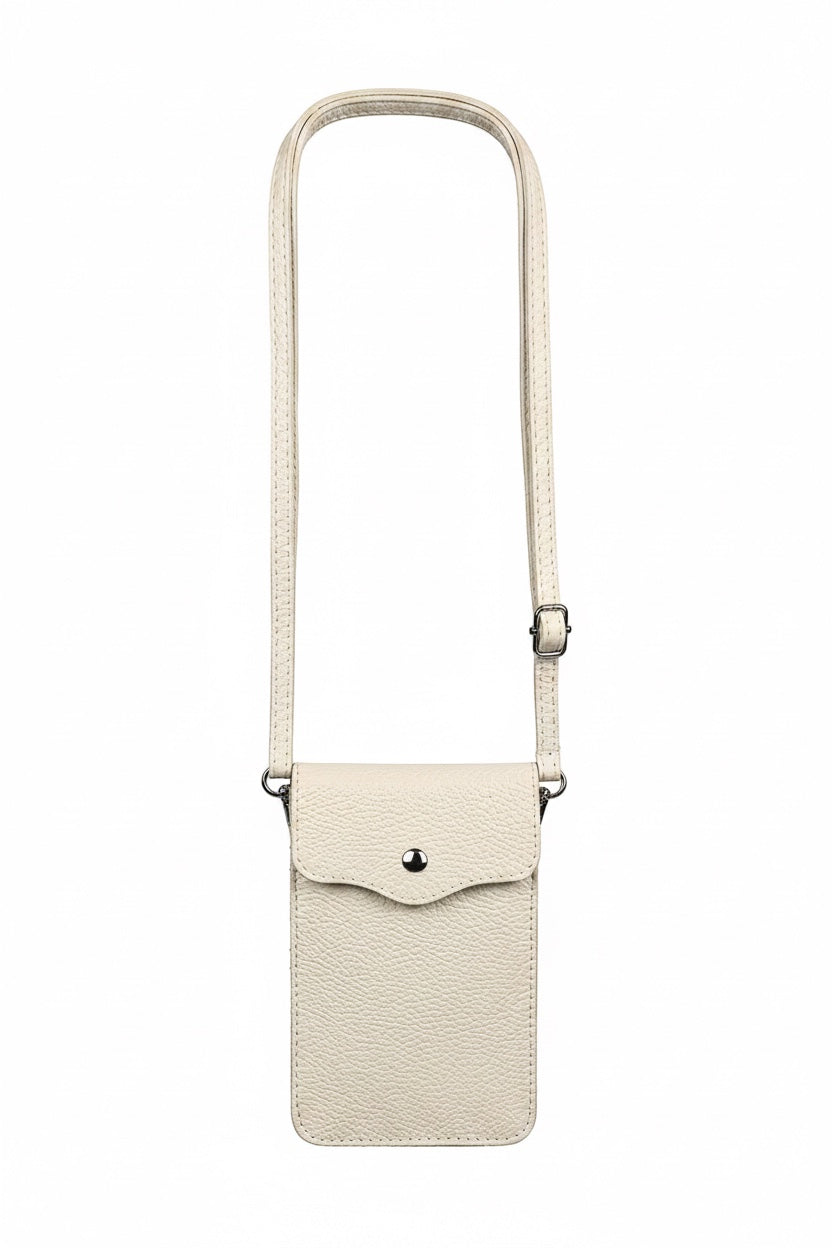 Eclectic genuine pebbled leather phone crossbody bag in cream with silver-tone hardware and adjustable strap.