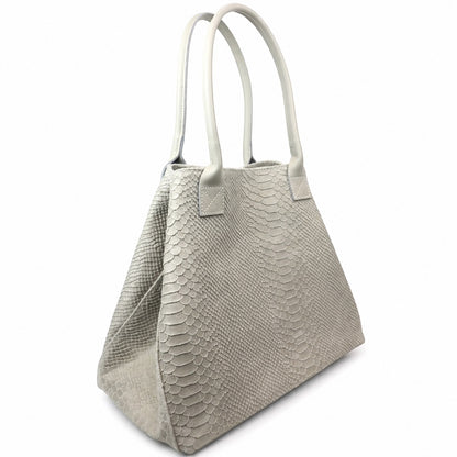 Eclectic cream suede shopper bag with snake-print texture and top handles, shown in a convertible handbag silhouette.