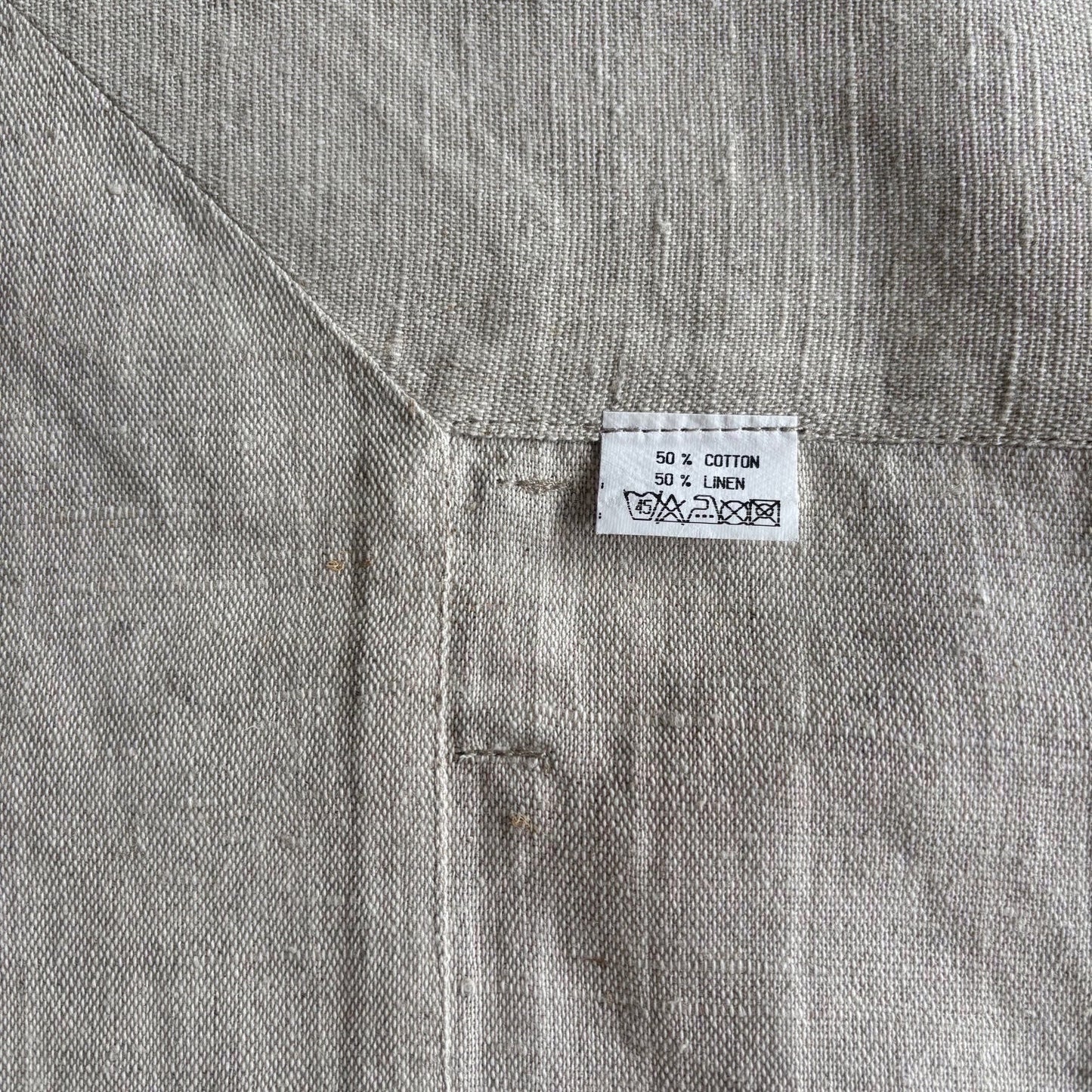Eclectic Daiva Lino natural stone coloured linen cotton blend tablecloth with visible woven texture and care label
