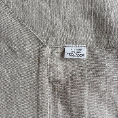 Eclectic Daiva Lino natural stone coloured linen cotton blend tablecloth with visible woven texture and care label