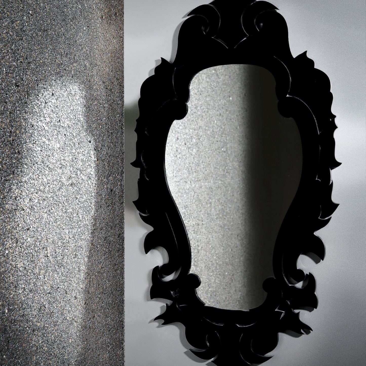 Eclectic Damask Mirror featuring a bold, baroque-inspired black acrylic frame with an ornate, sculptural silhouette.