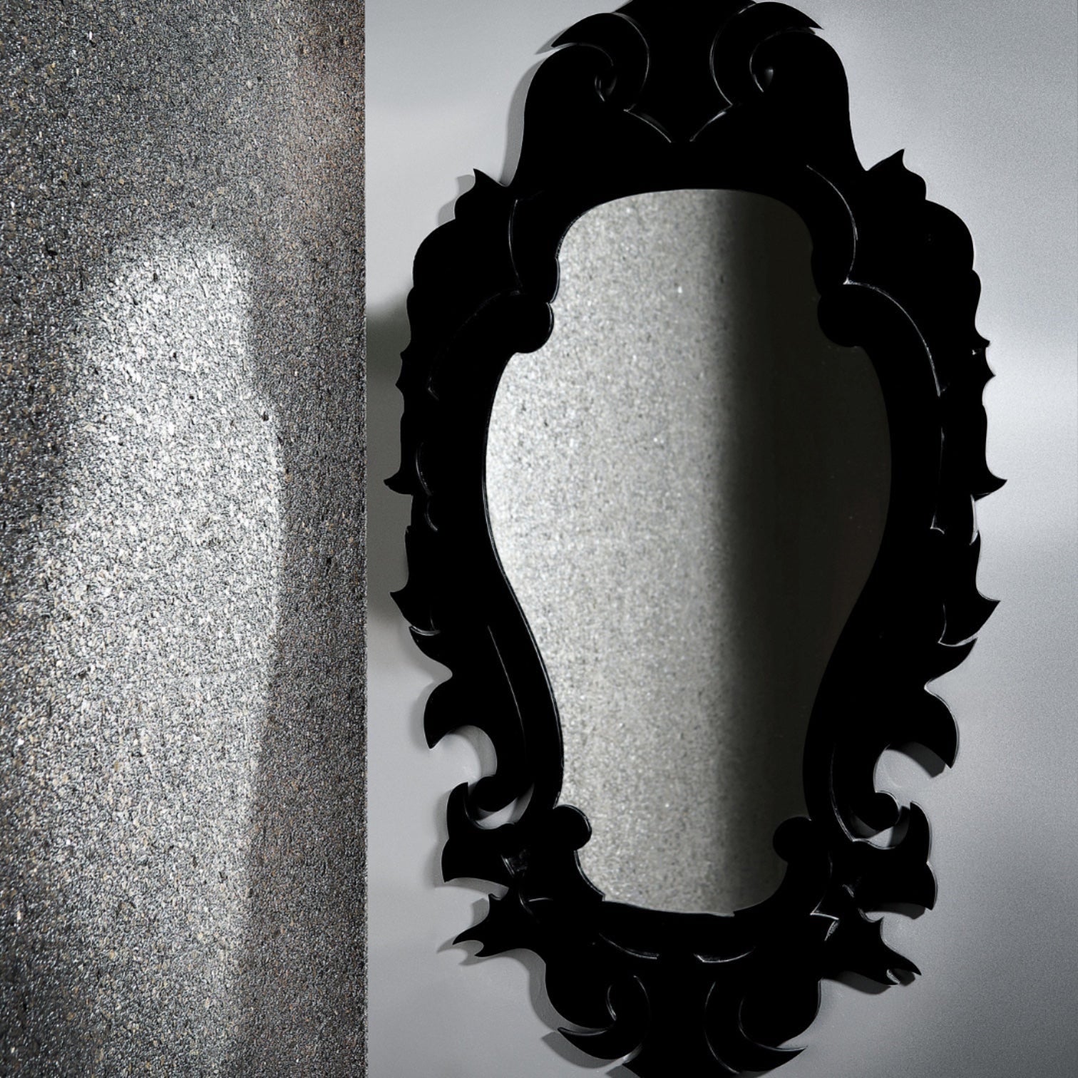 Eclectic Damask Mirror featuring a bold, baroque-inspired black acrylic frame with an ornate, sculptural silhouette.
