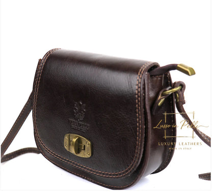Eclectic dark brown Italian leather crossbody bag with brushed brass twist-lock hardware and adjustable shoulder strap