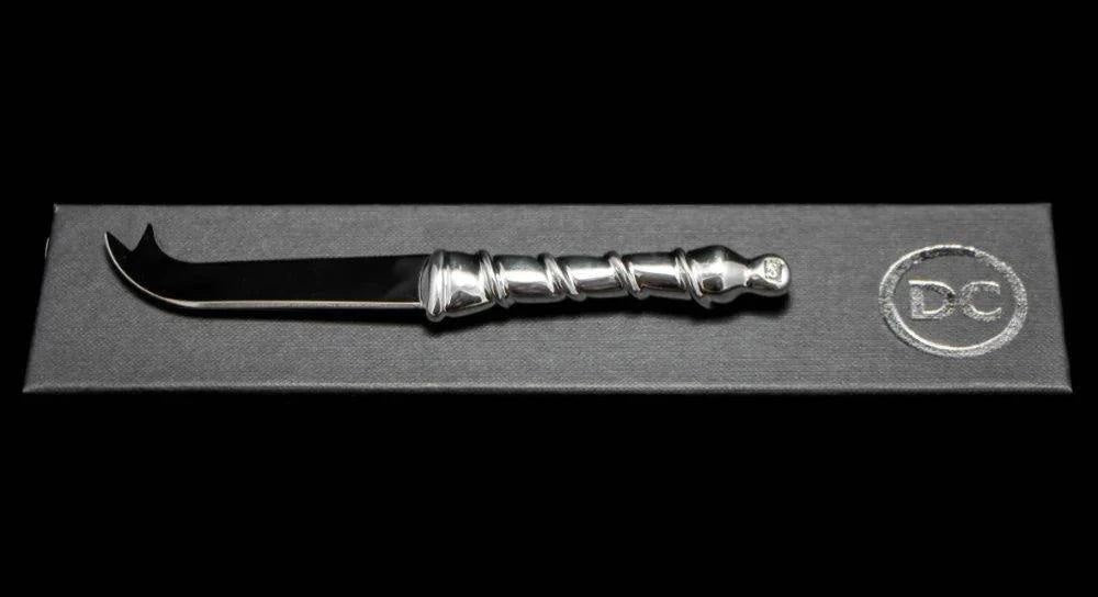 Eclectic Diana Carmichael Ribbon pewter cheese knife with a vine-inspired handle, presented in a branded gift box.