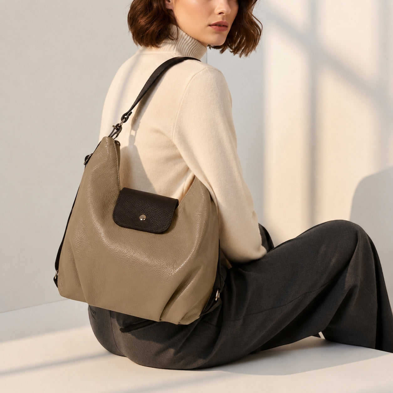 Eclectic Donatello Duo taupe grain leather convertible bag worn as a shoulder bag with black contrast and silver hardware