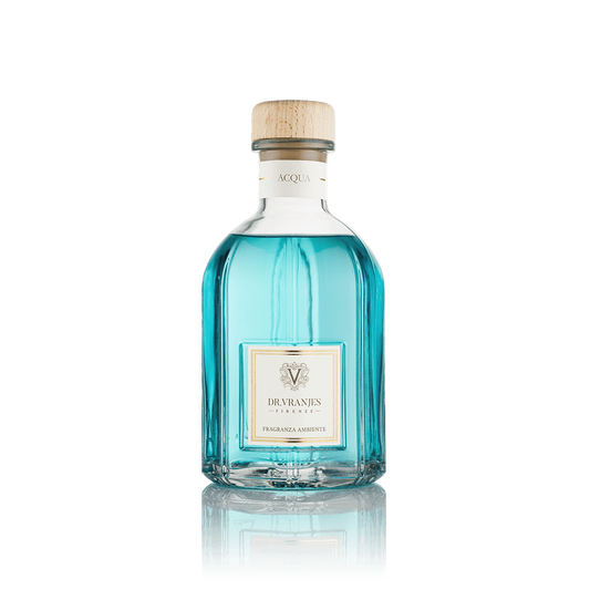 Eclectic Dr Vranjes Acqua reed diffuser in a clear glass bottle with blue fragrance liquid and a wooden cap.