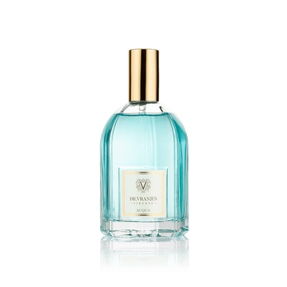 Eclectic Dr. Vranjes Acqua room spray in a clear glass bottle with a gold cap and light blue fragrance liquid