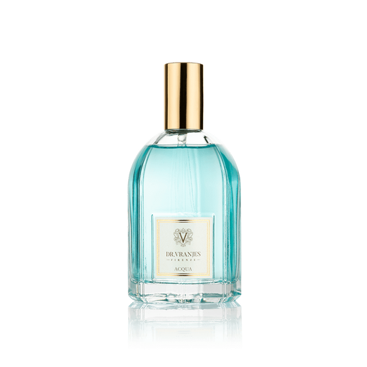 Eclectic Dr. Vranjes Acqua room spray in a clear glass bottle with a gold cap and light blue fragrance liquid
