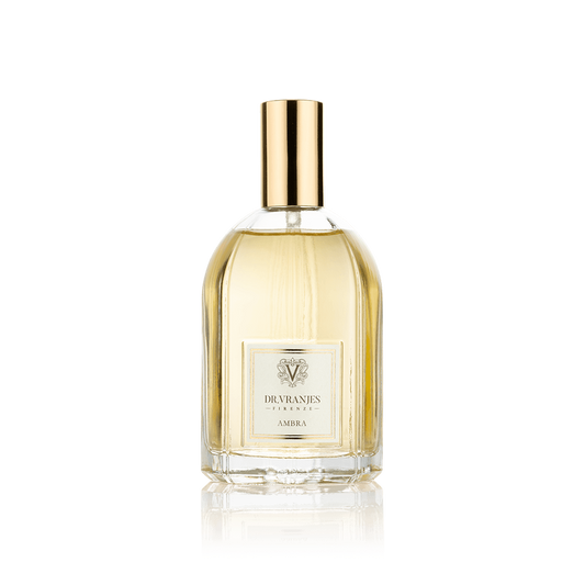 Eclectic Dr. Vranjes Ambra room spray in a 100ml glass bottle with a gold cap against a black background.
