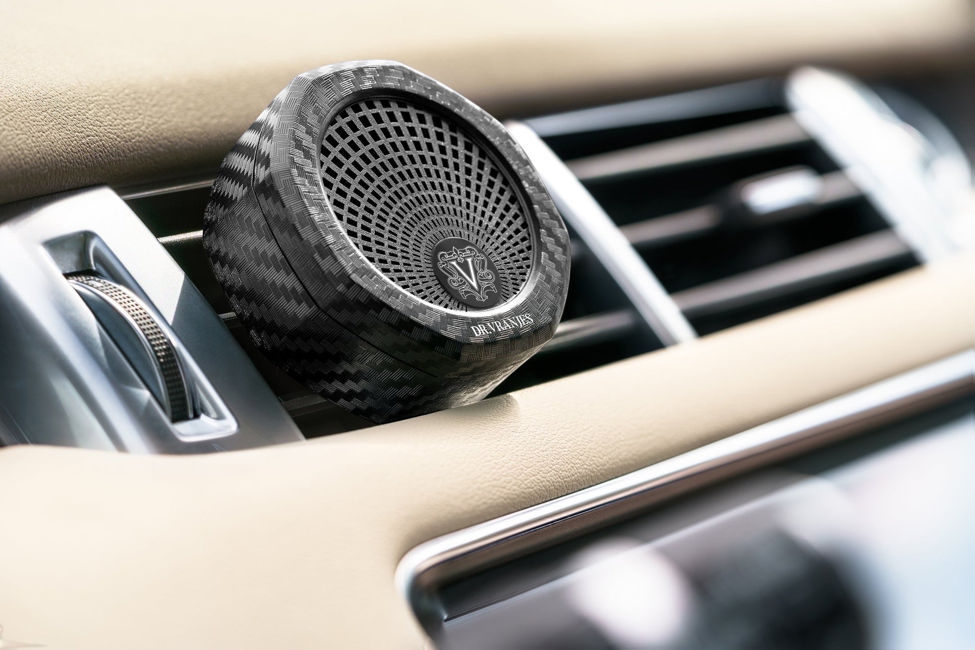 Eclectic Dr Vranjes carbon fibre car air vent diffuser with octagonal architectural design in a luxury car interior