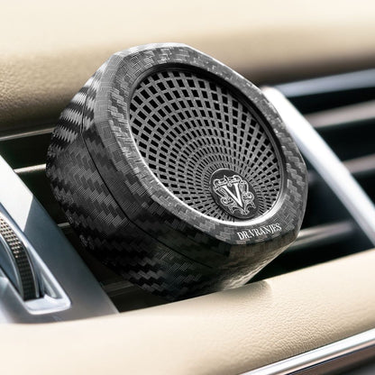 Eclectic Dr. Vranjes carbon fibre car air vent diffuser with an octagonal design and adjustable scent intensity lever.