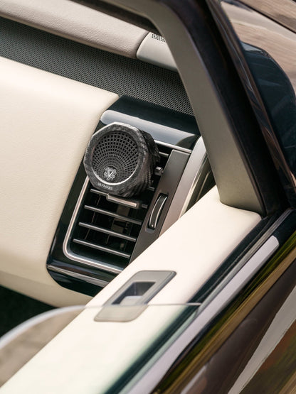 Eclectic Dr Vranjes carbon fibre car air vent diffuser with octagonal design mounted in a luxury car interior