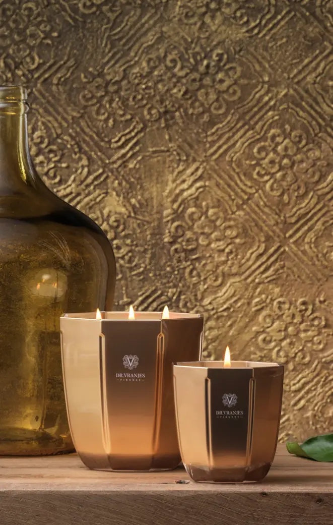 Eclectic Dr. Vranjes Firenze Oud Nobile scented candles in metallic gold faceted glass jars with burning wicks