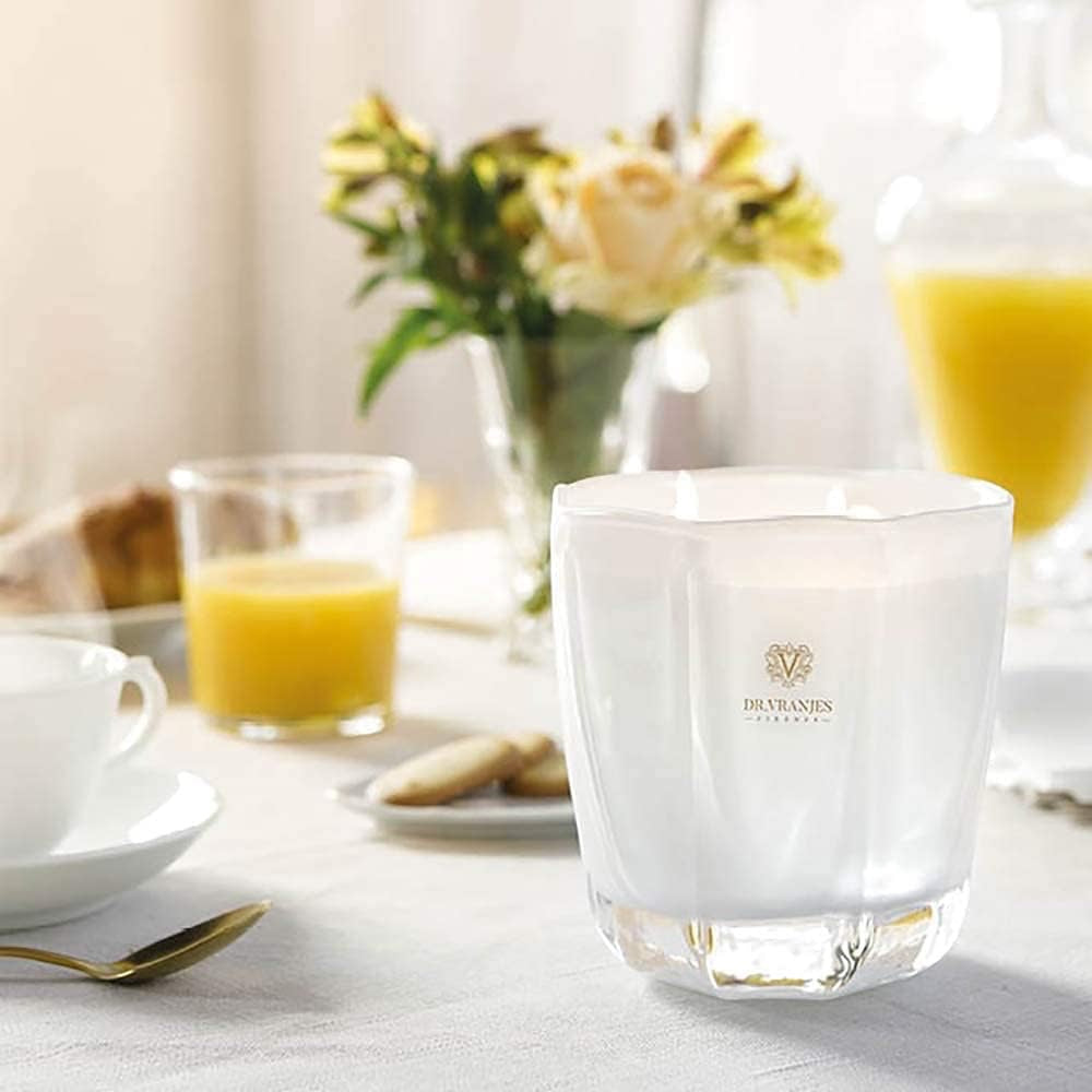Eclectic Dr. Vranjes Ginger Lime scented candle in a pearl-coloured glass vase on a breakfast table setting.