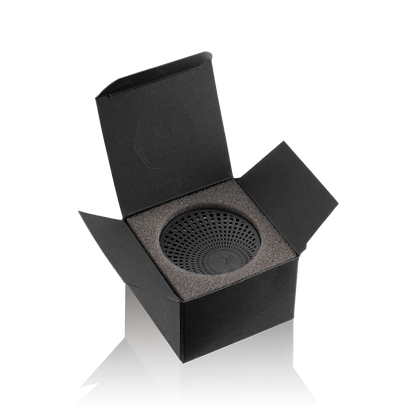 Eclectic Dr Vranjes Ginger Lime Carparfum refill in a black box with a circular diffuser insert on a black background.