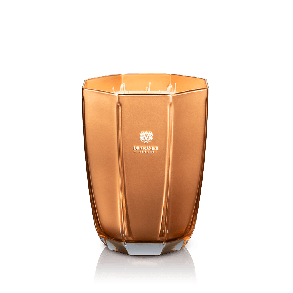 Eclectic Dr. Vranjes Oud Nobile scented candle in a luxurious gold-coloured glass vase against a black background.
