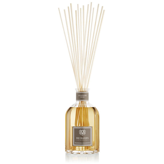 Eclectic Dr Vranjes Leather Oud reed diffuser in a classic glass bottle with natural rattan sticks for home fragrance.