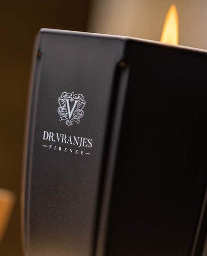 Eclectic Dr. Vranjes Onyx Ambra scented candle in a matte black glass vessel with a glowing flame.
