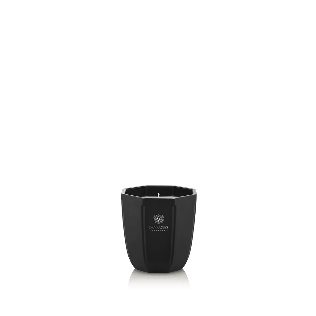 Eclectic Dr. Vranjes Ambra scented candle in a sleek, onyx-coloured glass vase with a minimalist hexagonal design.