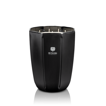 Eclectic Dr. Vranjes Ambra scented candle in a sleek, faceted onyx-coloured glass vase against a black background.