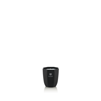 Eclectic Dr Vranjes Ambra scented candle in a sleek onyx-coloured glass vase against a black background.