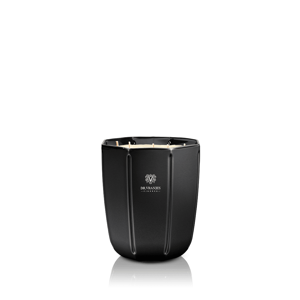 Eclectic Dr. Vranjes Ambra scented candle in a sleek, faceted onyx-coloured glass vase against a black background.
