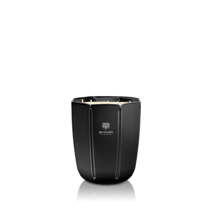 Eclectic Dr. Vranjes Ambra scented candle in a sleek, faceted onyx-coloured glass vase against a black background.