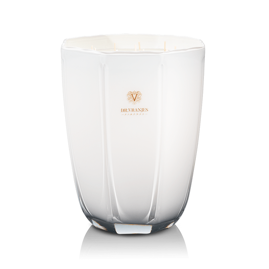 Eclectic Dr. Vranjes Ginger Lime scented candle in an elegant pearl-coloured glass vase with a gold logo.