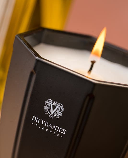 Eclectic Dr. Vranjes Rosa Tabacco scented candle in an elegant black onyx glass vase with a lit wick.