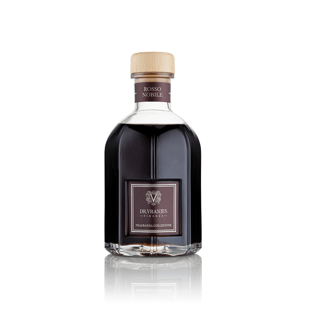 Eclectic Dr Vranjes Rosso Nobile reed diffuser in a signature glass bottle with a light wood cap on black background