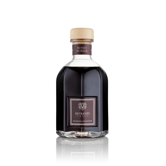 Eclectic Dr Vranjes Rosso Nobile reed diffuser in a signature glass bottle with a light wood cap on black background