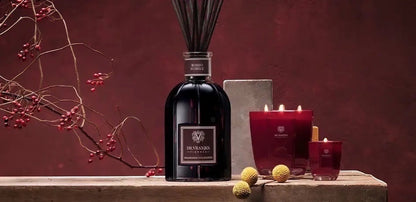 Eclectic Dr. Vranjes Rosso Nobile luxury gift set featuring a 500ml reed diffuser and ruby-red scented candles.
