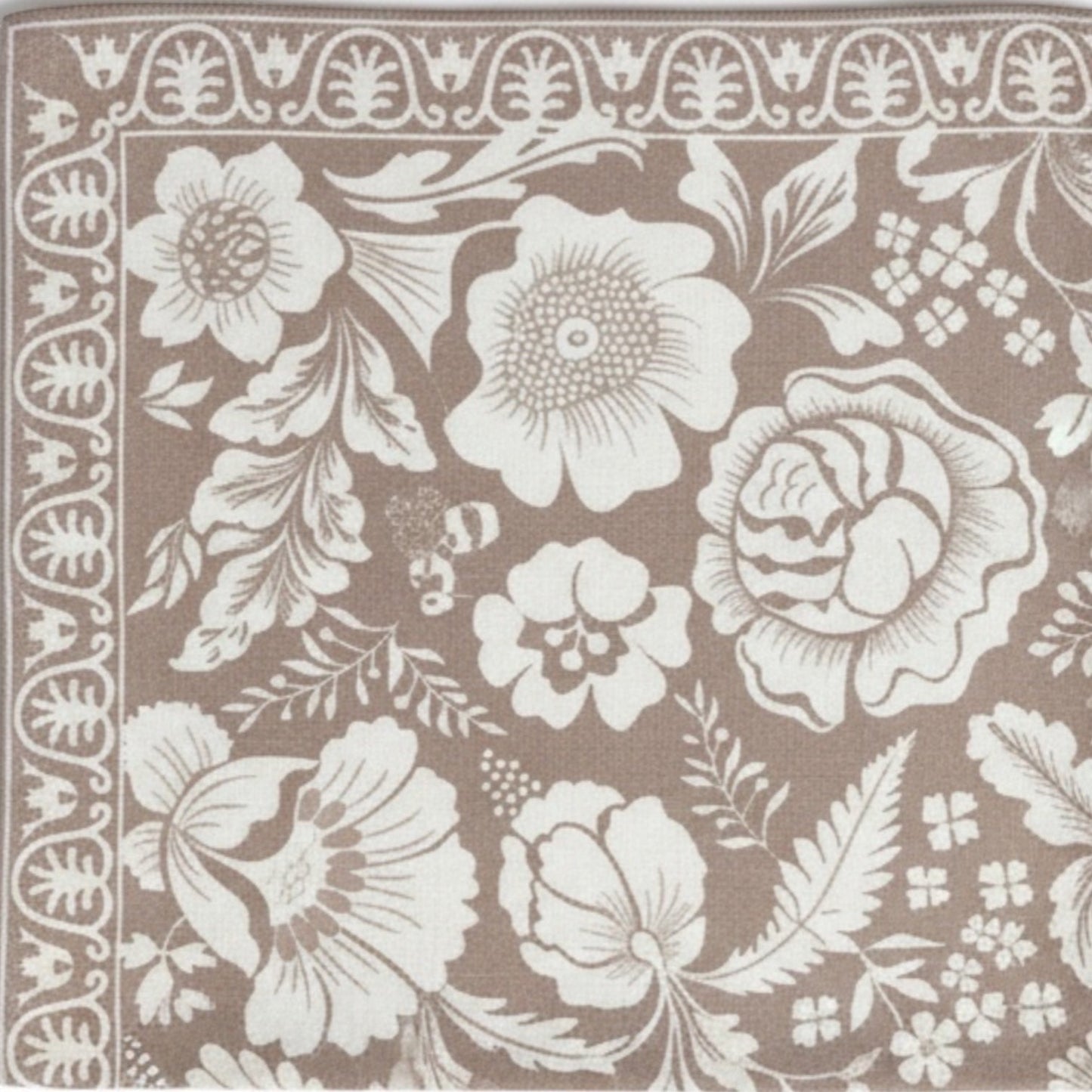 Eclectic dusty pink napkin with white European botanical floral pattern and decorative border in linen-look fabric.