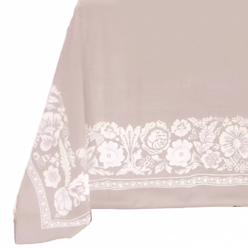 Eclectic dusty pink floral tablecloth with a linen-look finish and white European-inspired botanical border pattern.