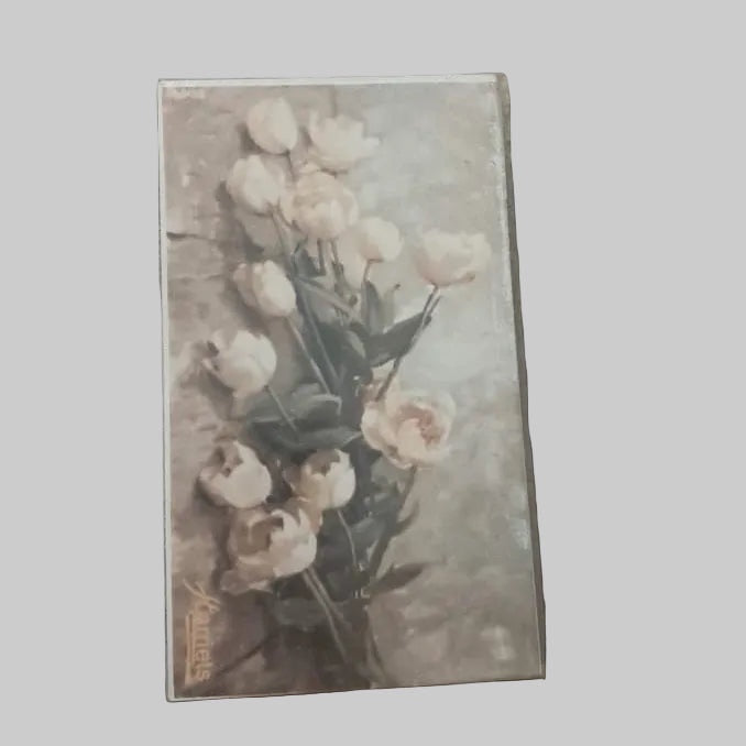 Eclectic decorative matchbox featuring a vintage-style floral bouquet illustration of white tulips on a soft background