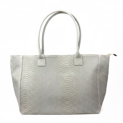 Eclectic Florenza cream suede shopper bag with snake-print texture and top handles against a white background.