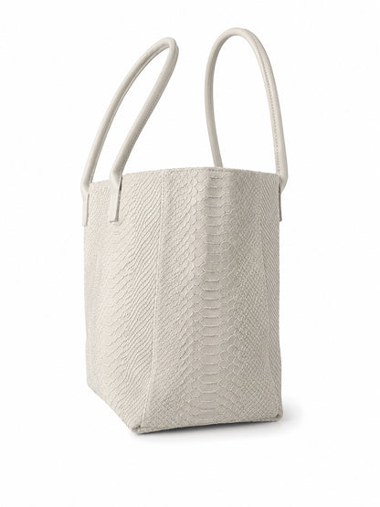 Eclectic Florenza cream suede shopper bag with snake-print texture and top handles on a white background.