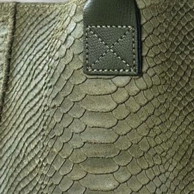 Eclectic Florenza olive suede shopper bag featuring a detailed snake-print texture and reinforced handle stitching.