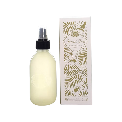 Eclectic Forest Fern room and linen mist in a frosted glass bottle next to its decorative botanical print box.