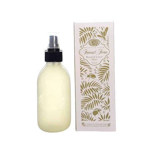 Eclectic Forest Fern room and linen mist in a frosted glass bottle next to its decorative botanical print box.