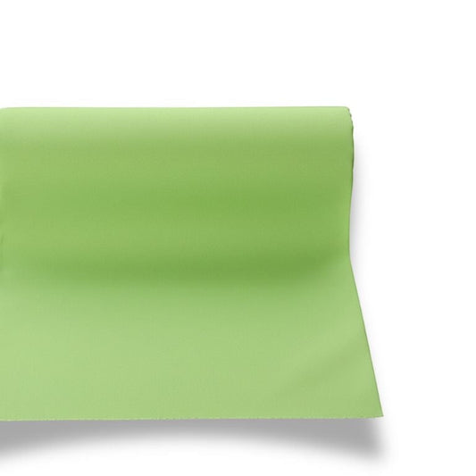 Eclectic Françoise Paviot anise green airlaid table runner roll with a soft linen-like texture for modern table decor.