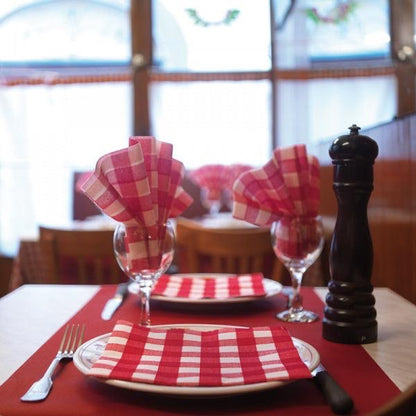 Eclectic Françoise Paviot Bistrot Rouge red and white gingham airlaid dinner napkins styled on a French bistro table.