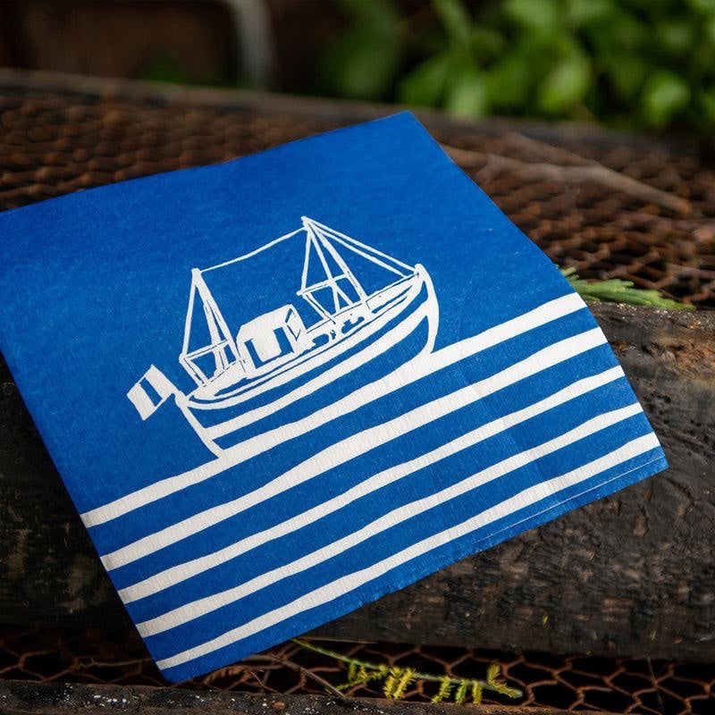 Eclectic Françoise Paviot Chalutier dinner napkin in blue with a white vintage fishing boat print on airlaid paper